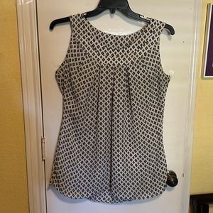Light and breezy white sleeveless top with navy and light blue  diamond pattern